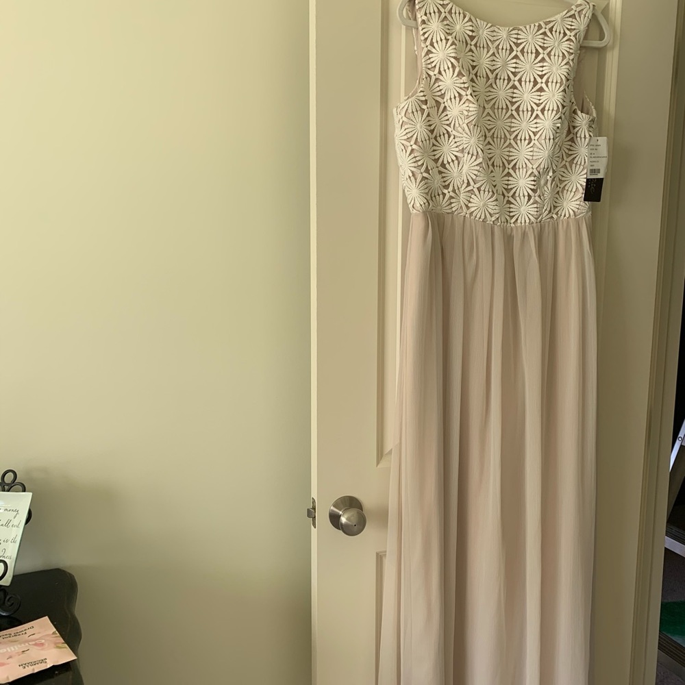 Sleeveless with appliqué overlay on top